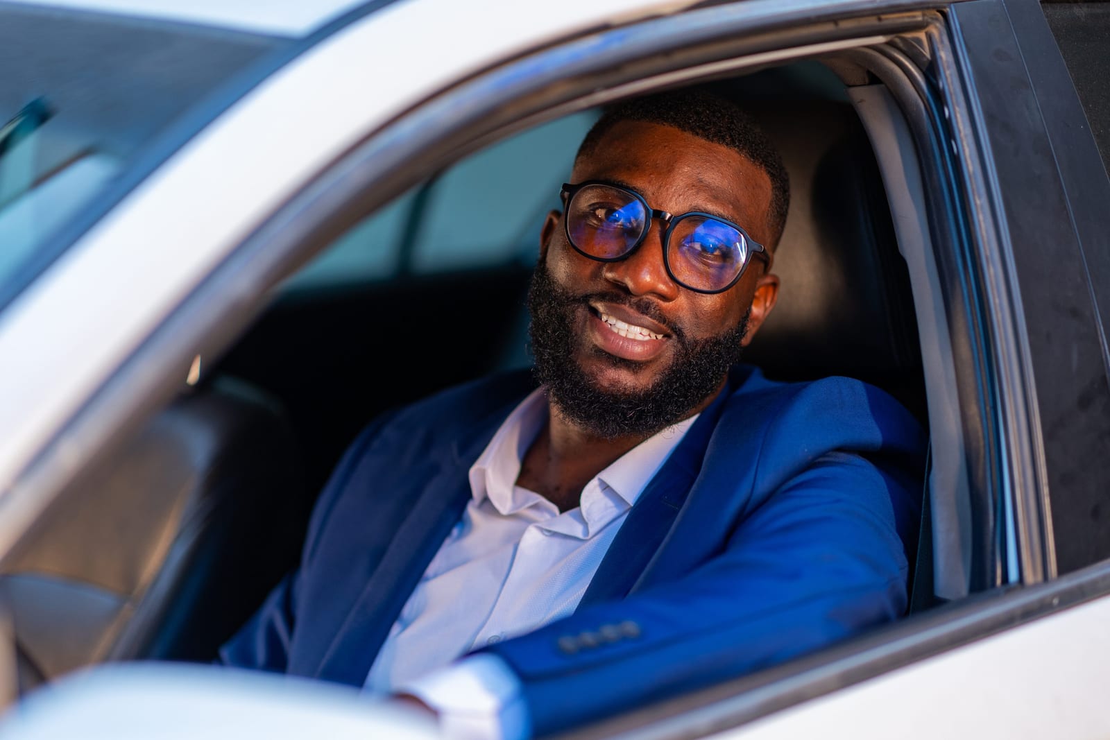 QuickLyft driver behind the wheel using the app